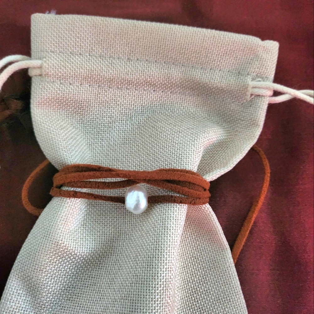 Fresh water pearl with leather cord